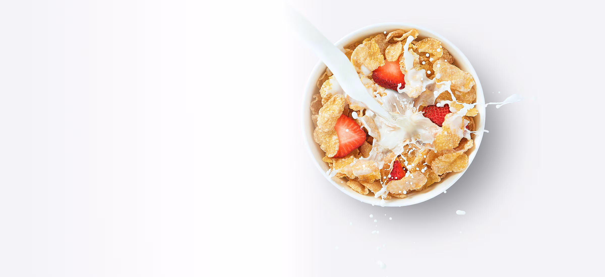 Frosted Flakes cereal with strawberries in milk